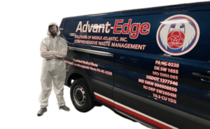 Technician in hazmat suit stands beside ASMAI van, ready for safe and compliant medical waste disposal services.