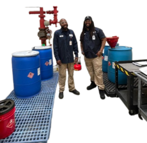 Image of 2 ASMAI employees working in our facility