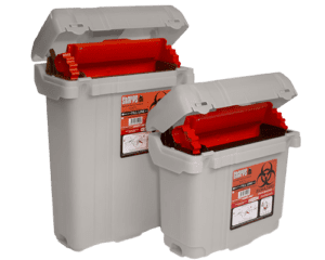 Reusable biohazard containers with red lids designed for safe and compliant sharps disposal in medical settings.