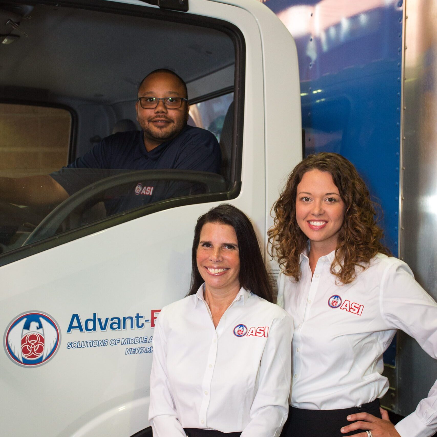 image of ASMAI employees posing with custom truck